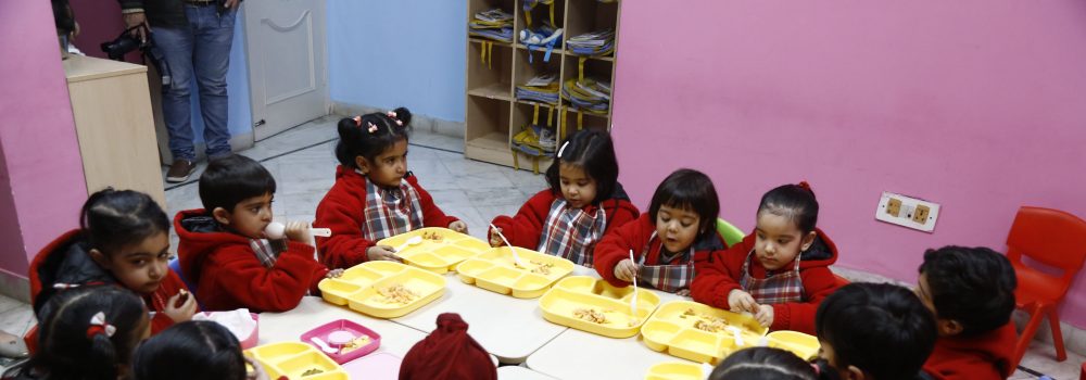 Childrens taking lunch